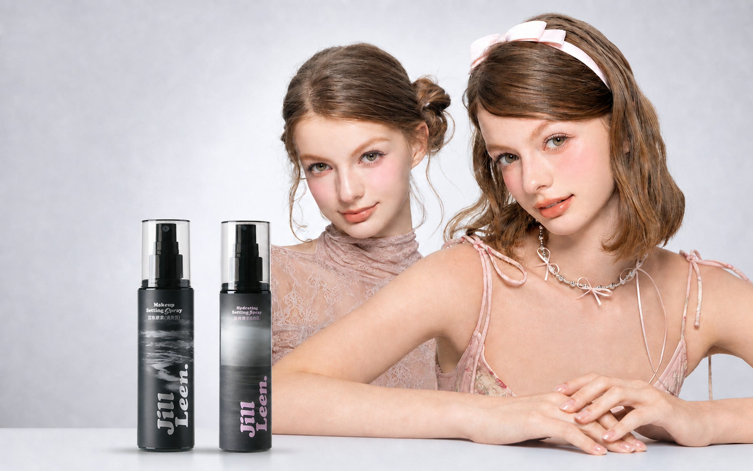 JILL LEEN setting spray campaign with two models and two setting spray bottles